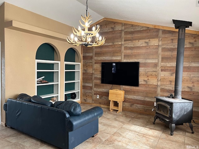 living room featuring a wood stove, lofted ceiling, light tile patterned floors, and wooden walls