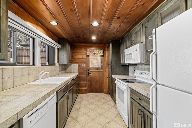 kitchen featuring backsplash, white appliances, sink, and wood ceiling