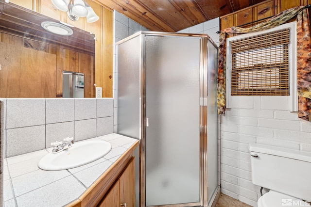 bathroom featuring vanity, toilet, tasteful backsplash, a shower with shower door, and wood ceiling