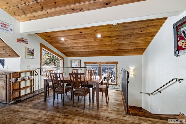 dining space with dark hardwood / wood-style flooring, wooden ceiling, and vaulted ceiling