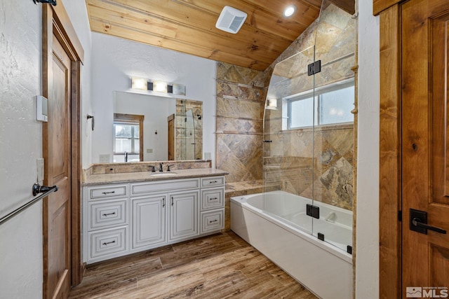 bathroom featuring wooden ceiling, hardwood / wood-style flooring, vaulted ceiling, and a healthy amount of sunlight