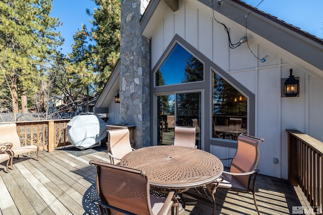 wooden deck with grilling area