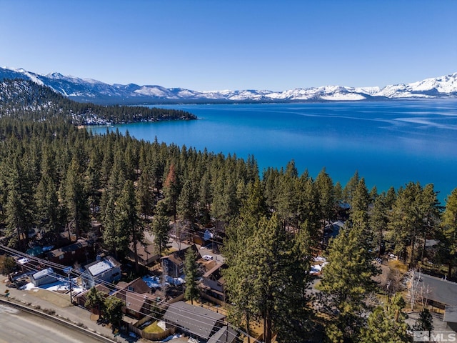 bird's eye view with a water and mountain view