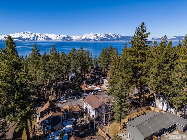 bird's eye view with a water and mountain view