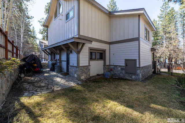 rear view of property with a patio area and a lawn