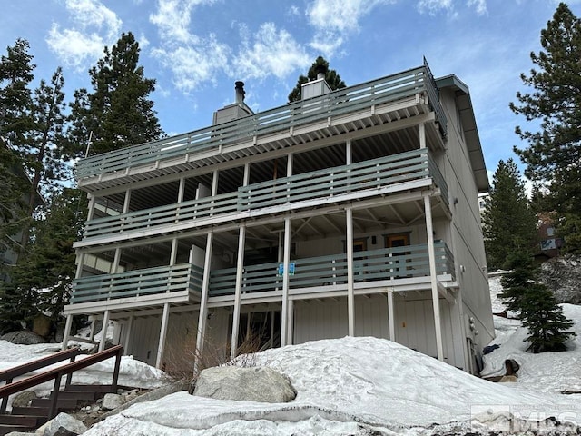 view of snow covered house