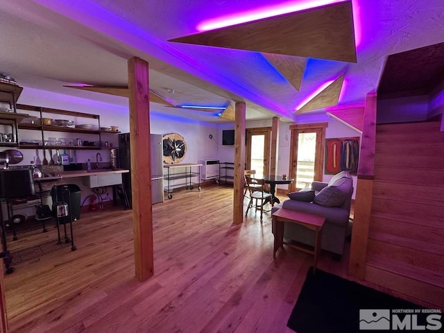 interior space with sink and hardwood / wood-style flooring