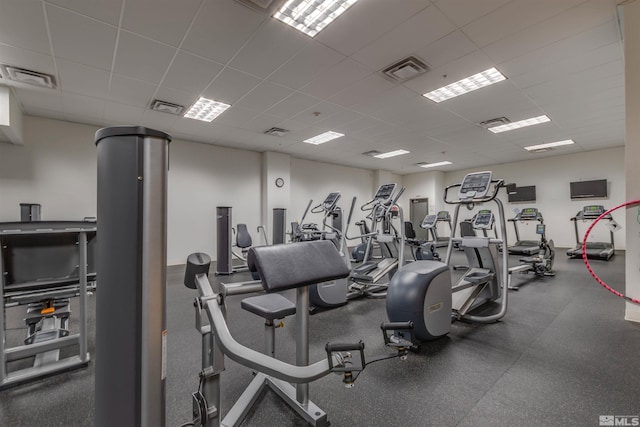 exercise room featuring a paneled ceiling