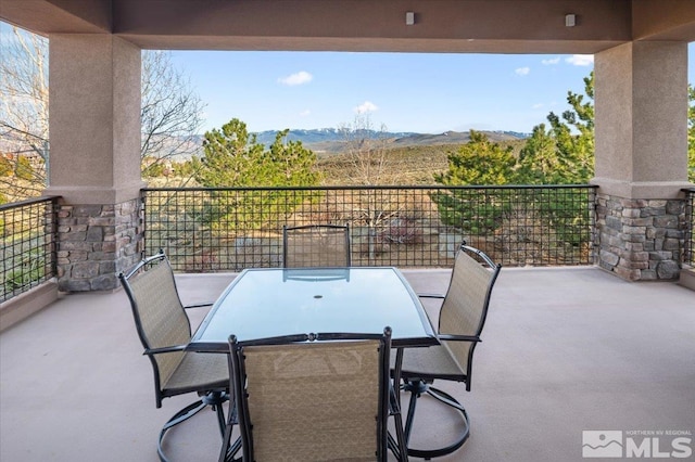 view of patio with a balcony