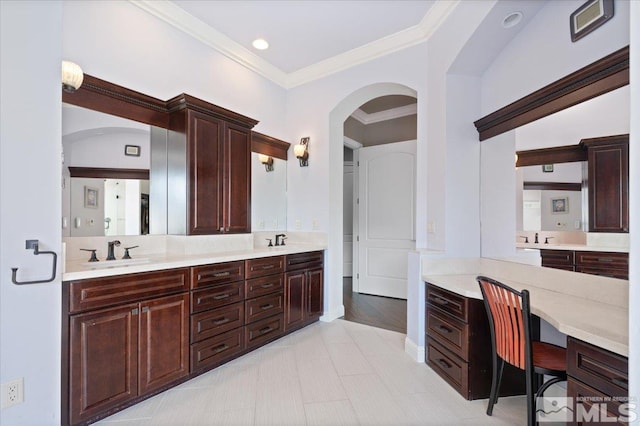 bathroom with large vanity, tile floors, double sink, and crown molding