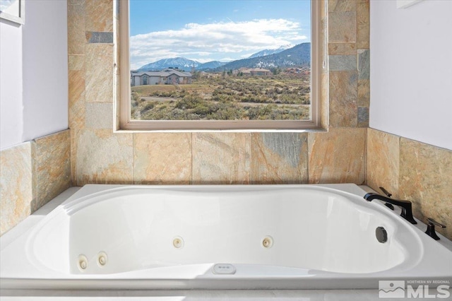 bathroom featuring a mountain view