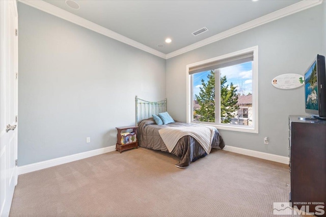 bedroom featuring ornamental molding and light colored carpet