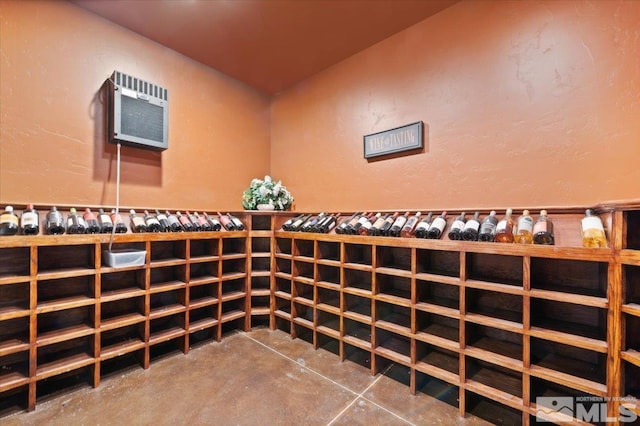 wine room featuring an AC wall unit