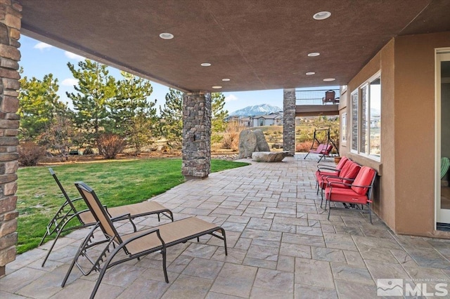 view of patio / terrace with a mountain view