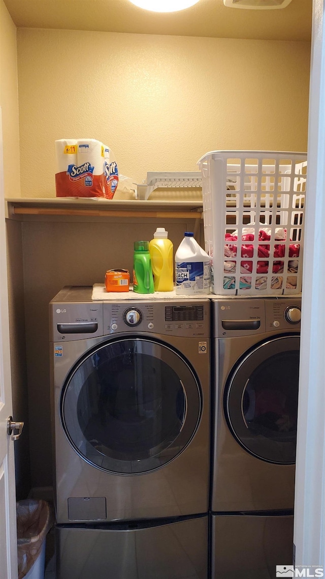 washroom featuring washer and dryer