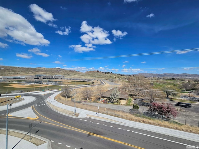 birds eye view of property featuring a mountain view