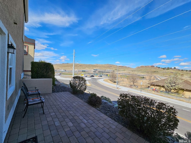 view of terrace with a mountain view