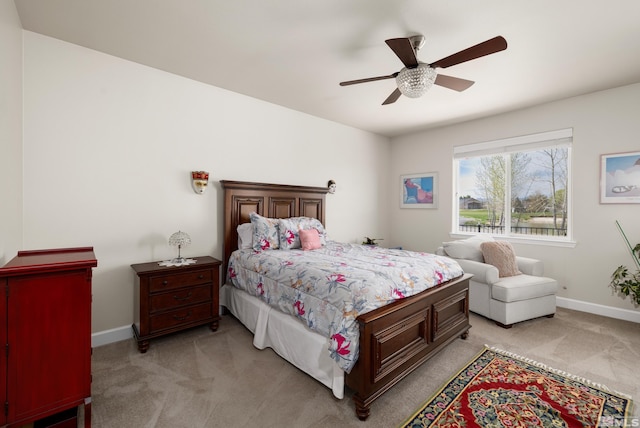 bedroom with light carpet and ceiling fan