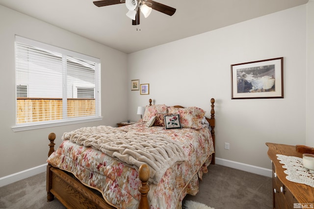 bedroom with ceiling fan and dark carpet