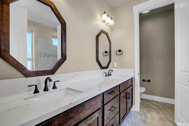 bathroom with tile floors, toilet, and dual vanity