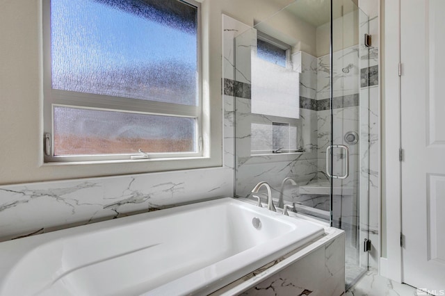 bathroom with tile floors, a wealth of natural light, and plus walk in shower