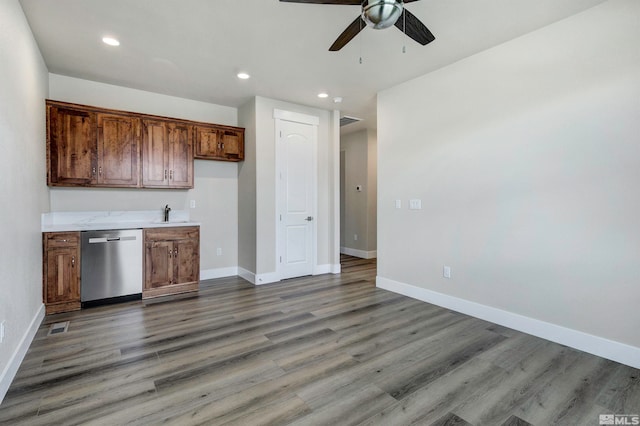 kitchen featuring sink, dark wood-type flooring, ceiling fan, and stainless steel dishwasher