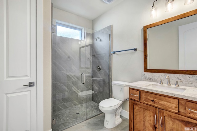 bathroom with a shower with shower door, toilet, tile flooring, and vanity