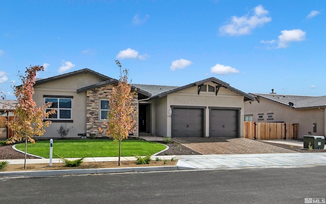 ranch-style home featuring a garage, central AC unit, and a front lawn