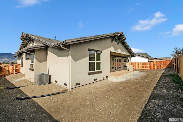 view of home's exterior with central AC unit