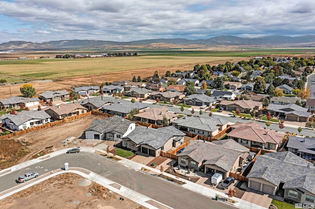 birds eye view of property featuring a mountain view