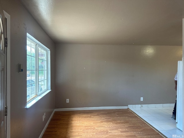 empty room with light tile floors