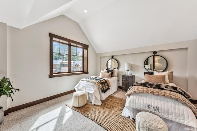 carpeted bedroom with lofted ceiling