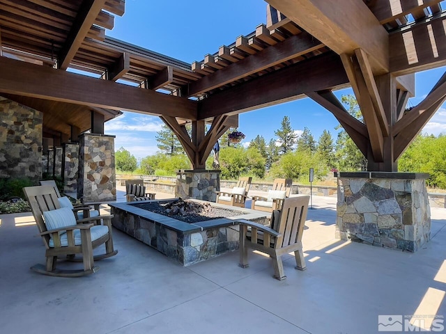 view of patio / terrace featuring a fire pit and a pergola