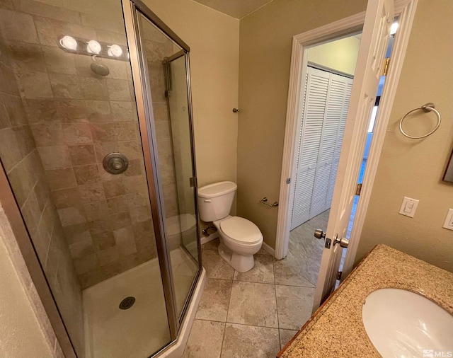 bathroom featuring walk in shower, vanity, and toilet