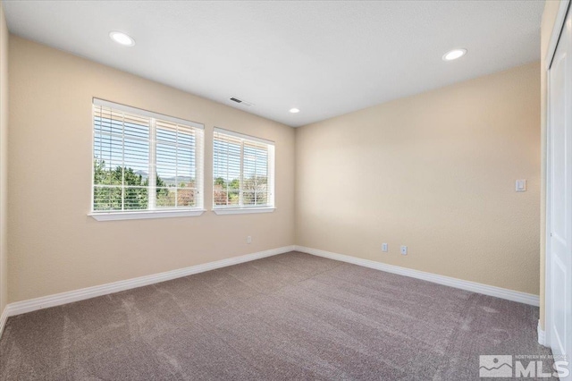 view of carpeted spare room