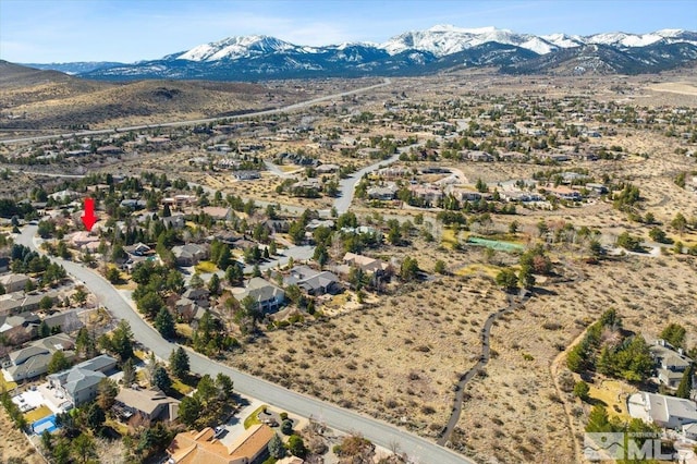 birds eye view of property featuring a mountain view