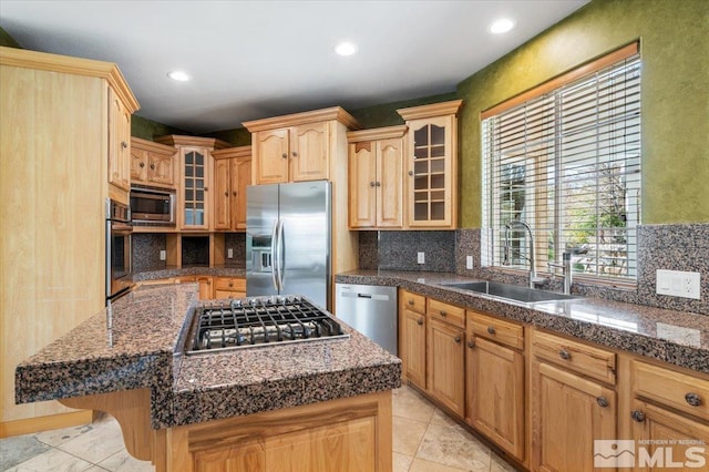 kitchen with a center island, light tile floors, sink, backsplash, and stainless steel appliances