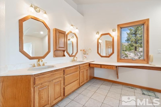 bathroom featuring double sink, tile flooring, and large vanity