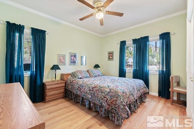 bedroom featuring ornamental molding, ceiling fan, and light wood-type flooring