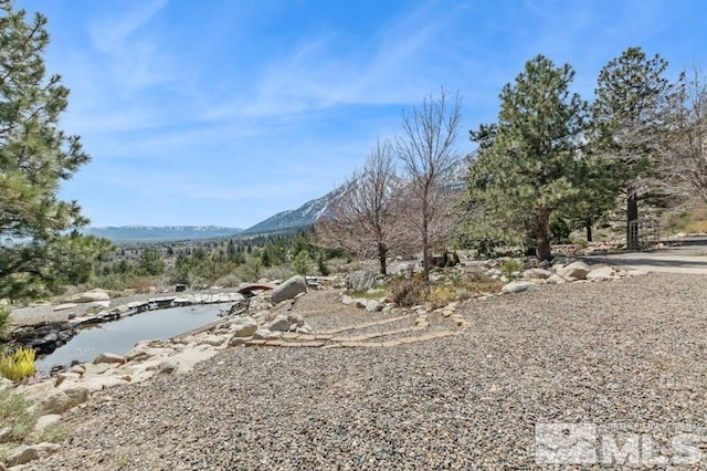 exterior space featuring a mountain view