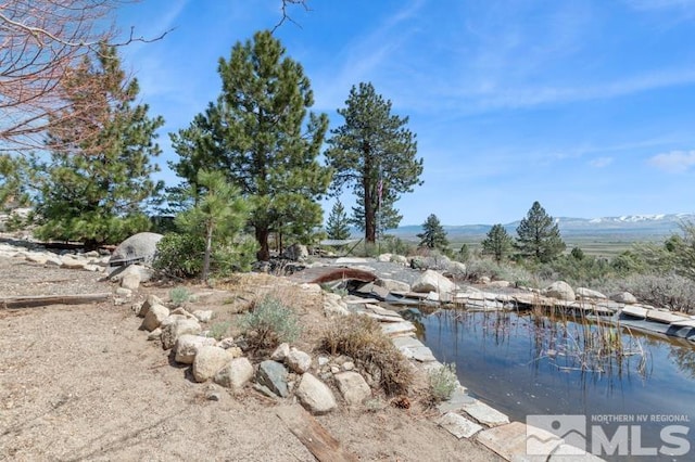 property view of water featuring a mountain view