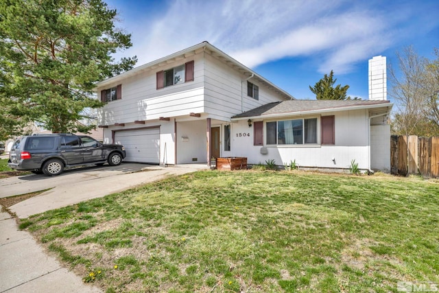 view of front of house with a front lawn and a garage