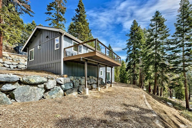 rear view of house featuring a deck