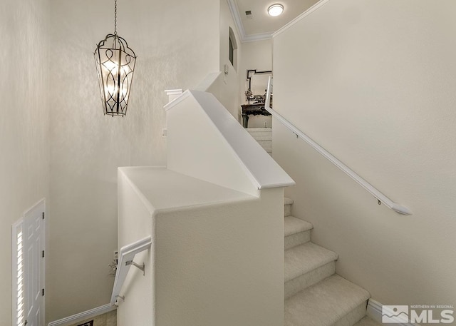 stairway with crown molding