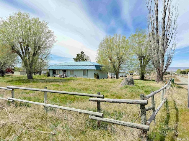 view of yard with a rural view