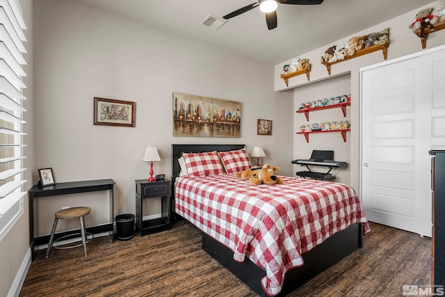 bedroom with dark wood-type flooring and ceiling fan