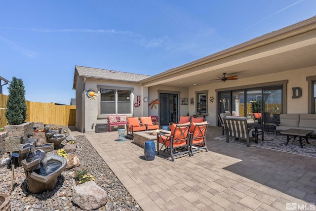 view of patio / terrace with an outdoor living space and ceiling fan