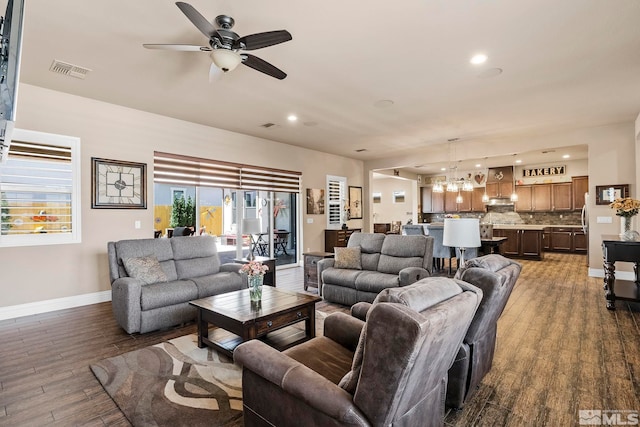 living room featuring hardwood / wood-style flooring and ceiling fan