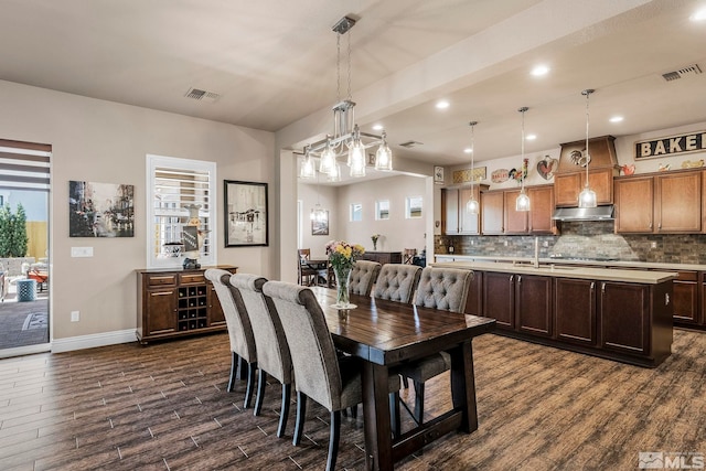 dining area featuring dark hardwood / wood-style flooring