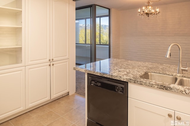 kitchen featuring light stone countertops, black dishwasher, white cabinets, sink, and light tile floors